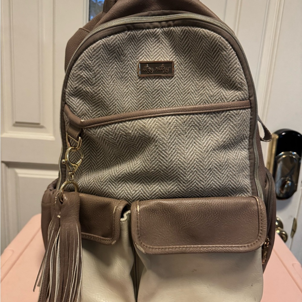 Itzy Ritzy Taupe and Cream Diaper Bag with Tassle and Changing Pad